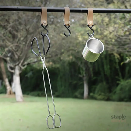 Long sturdy and heat-resistant charcoal tongs for grilling food. Made of stainless steel these portable tongs are