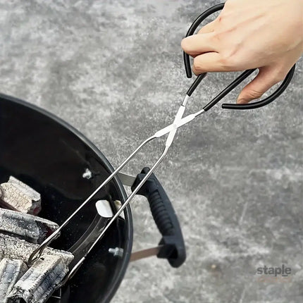 Long sturdy and heat-resistant charcoal tongs for grilling food. Made of stainless steel these portable tongs are