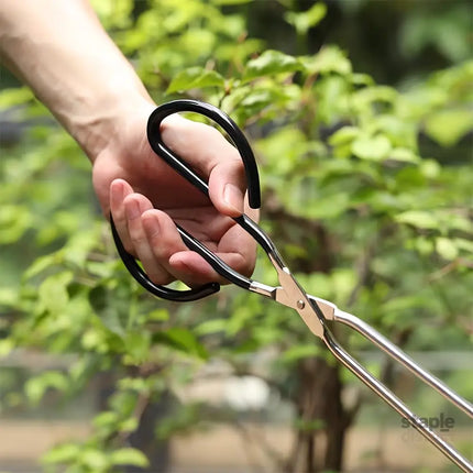 Long sturdy and heat-resistant charcoal tongs for grilling food. Made of stainless steel these portable tongs are