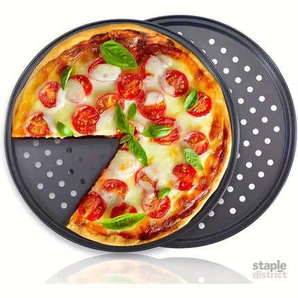 Two pizza baking pans each 30.48 cm in diameter feature ventilation holes for improved cooking efficiency and a